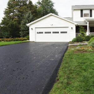 A beautiful driveway and home viewed from the curb