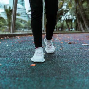 Someone walking on an asphalt walkway