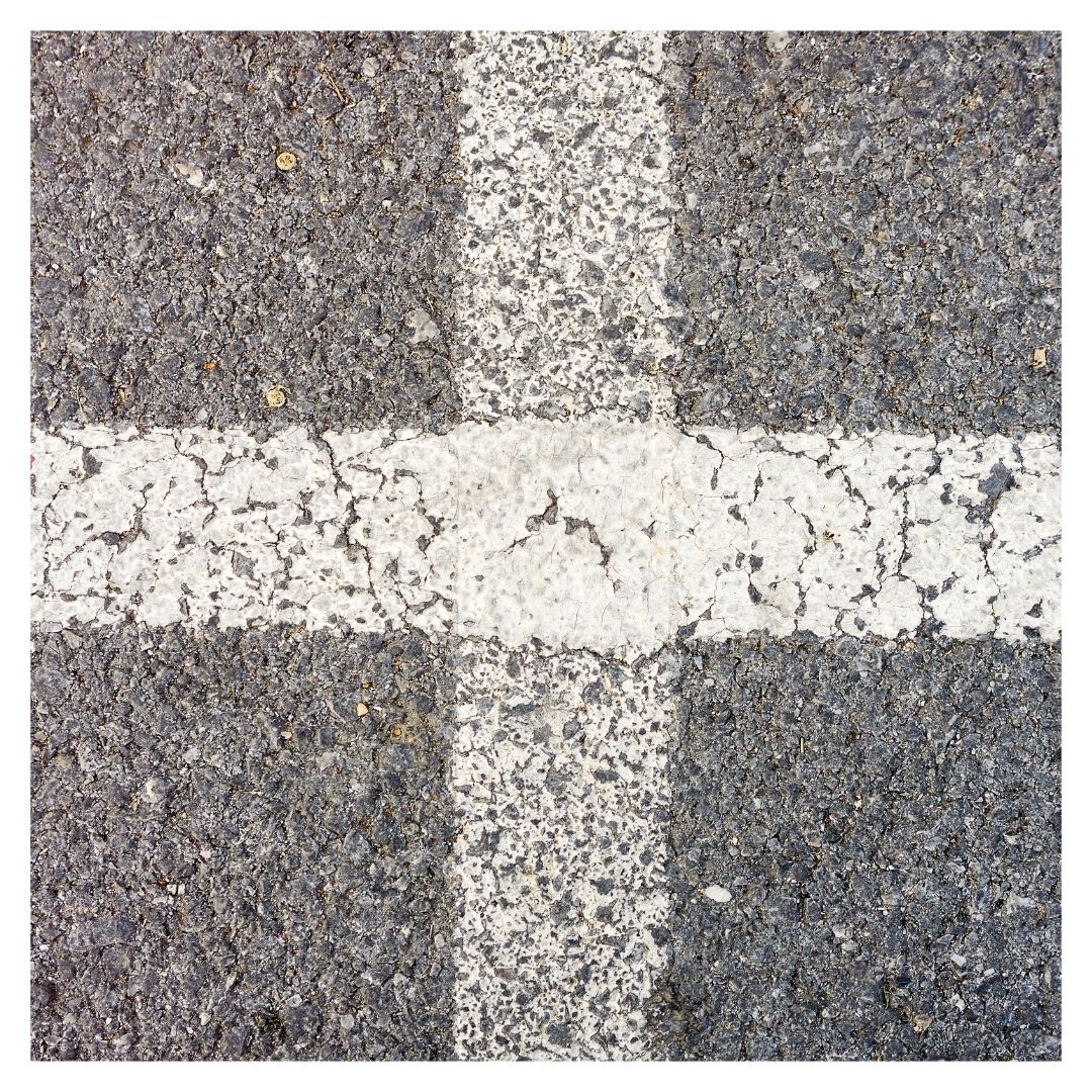 Faded lines on asphalt