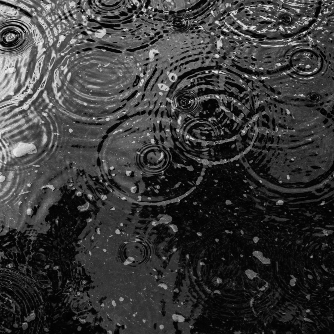 rain falling on asphalt.