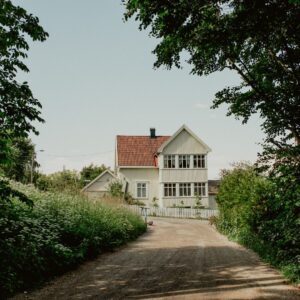 a home with a dirt road