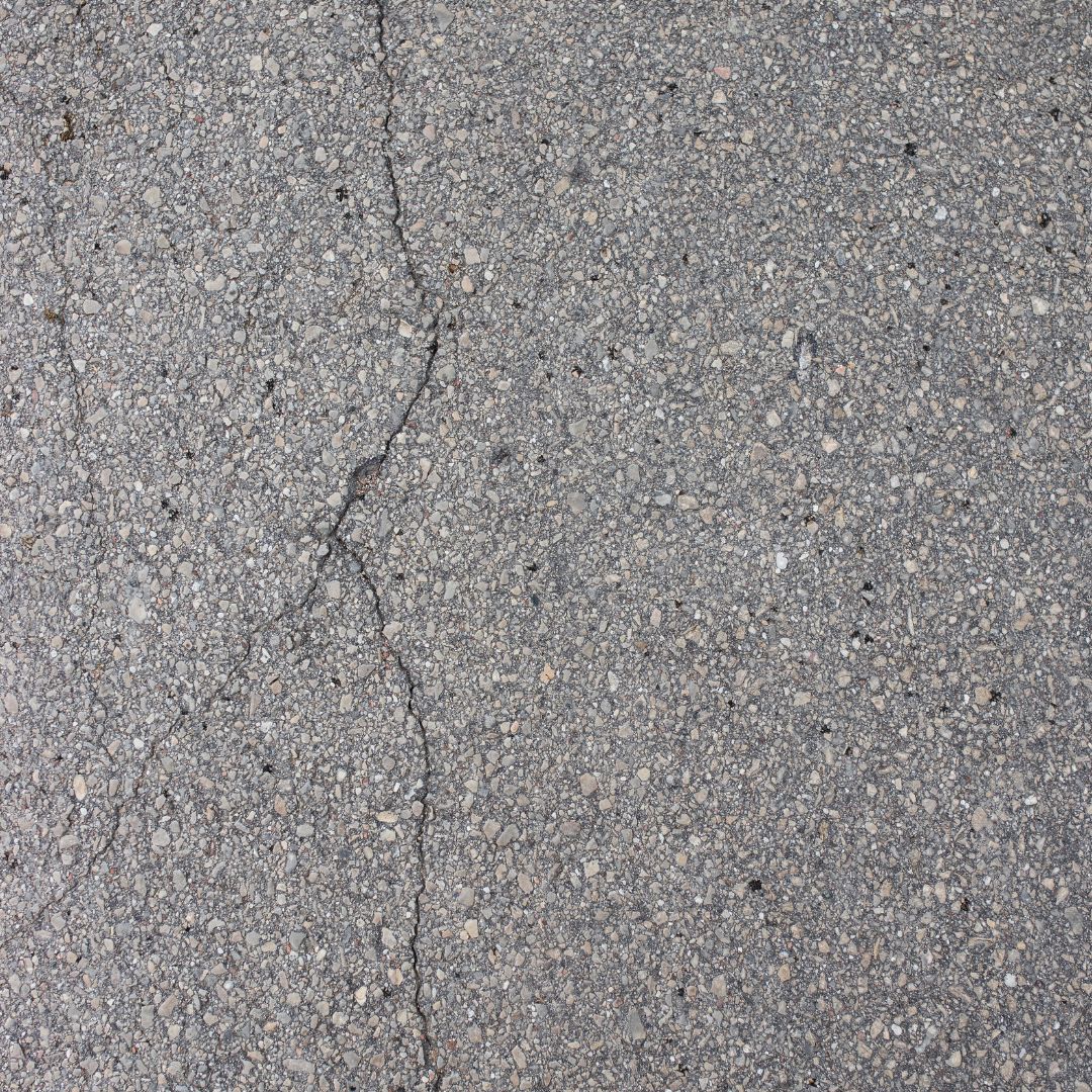 Crack in an asphalt driveway.